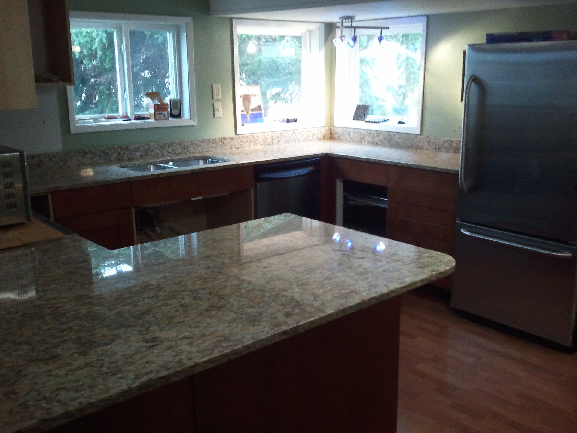 A kitchen with new granite countertops.