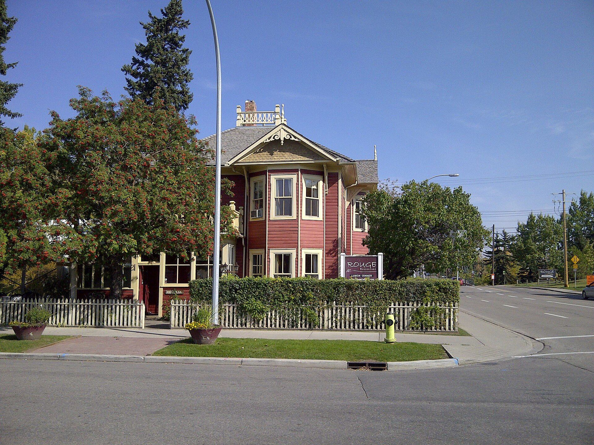 A red brick house with a turret in Calgary, Alberta.