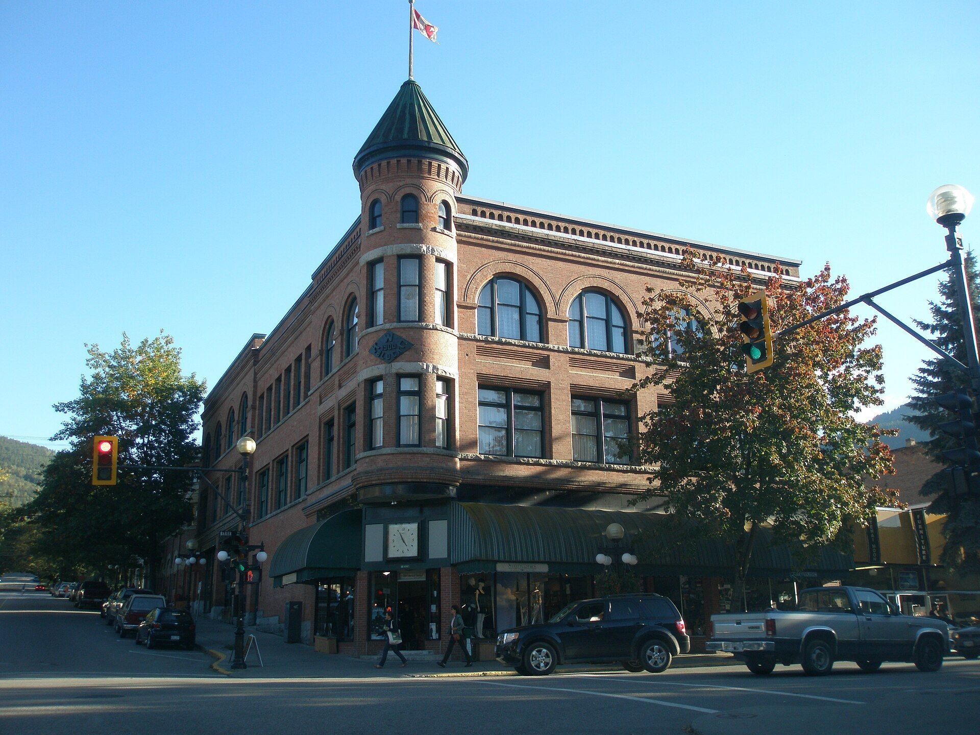 A brick heritage building with a corner turret in downtown Nelson, British Columbia.