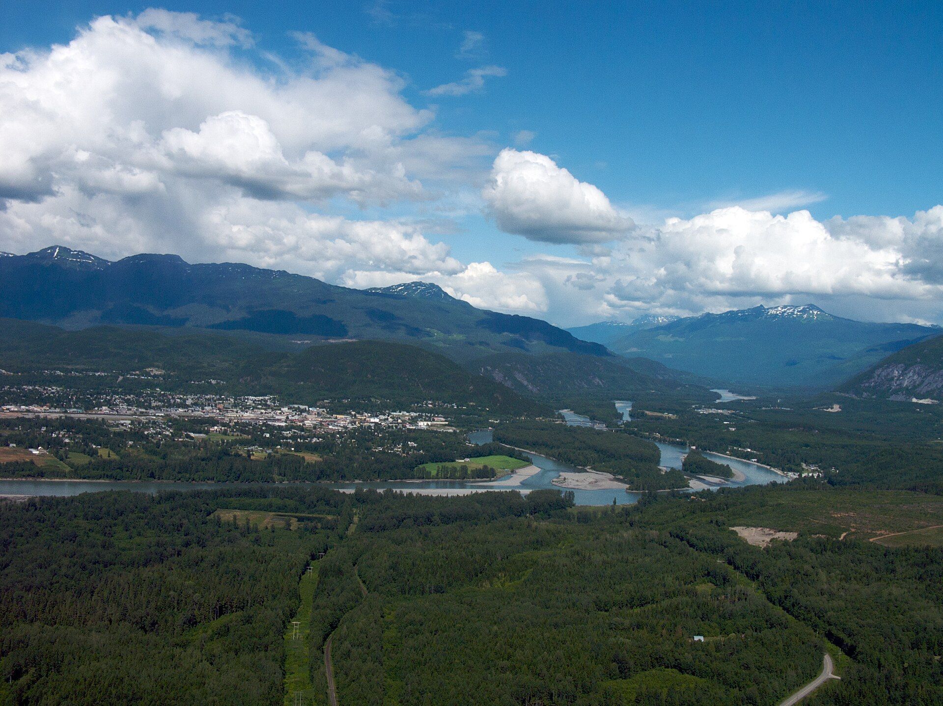 Terrace, British Columbia, seen from above, with mountains around the valley.