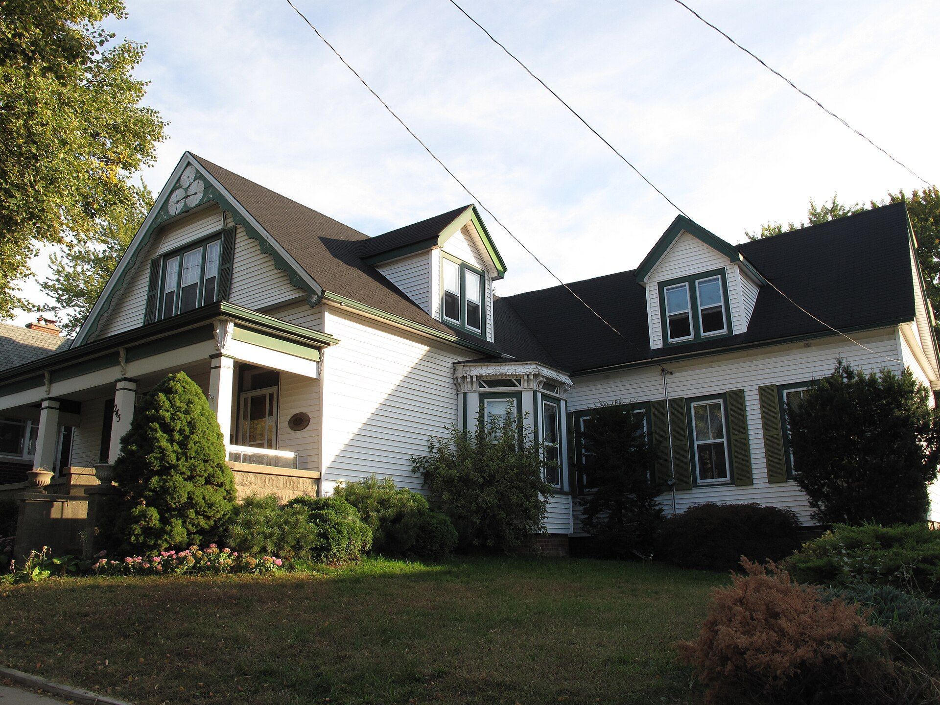Perry-Breault House, a white house with a wide front porch, in Windsor, Ontario.