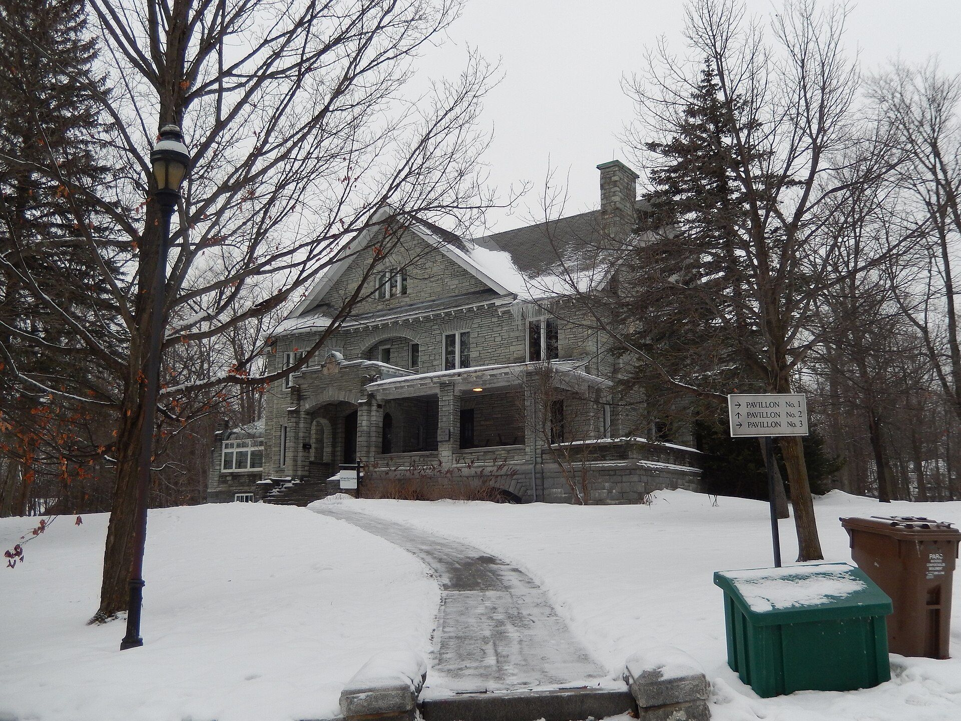 A large house in the snow at Parc du Domaine-Howard in Sherbrooke, Quebec.